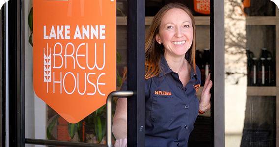 Photo of staff opening door for Lake Anne Brew House